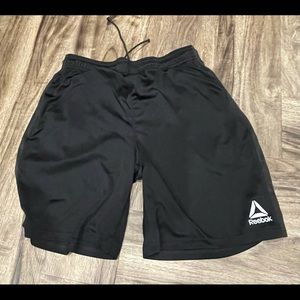 Men’s Medium dark gray Reebok gym shorts.